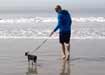 Brandon walking his dog at the beach